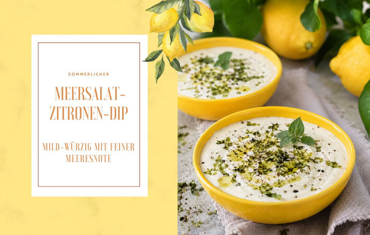 Sommerlicher veganer Meersalat-Zitronen-Dip in gelben Schalen, verfeinert mit grünen Meersalat-Flocken, Kräutern und Zitronen.