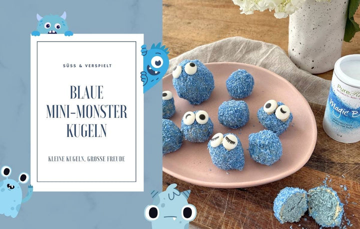 Blaue Mini-Monster-Kugeln mit Zuckeraugen auf rosa Teller, daneben weißer Becher mit „Magic Blue“.