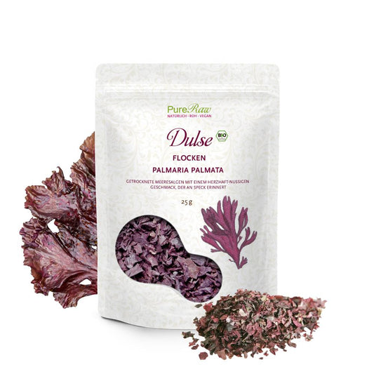 PureRaw Dulse Flocken Bio und Roh mit getrockneten Algenflocken neben der Packung