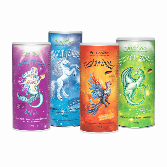 Set-Produktbild: PureRaw Zaubermischungen im Set: Meerjungfrauen Zauber, Einhorn Zauber, Phönix Zauber und Drachen Zauber in vier bunten Dosen.